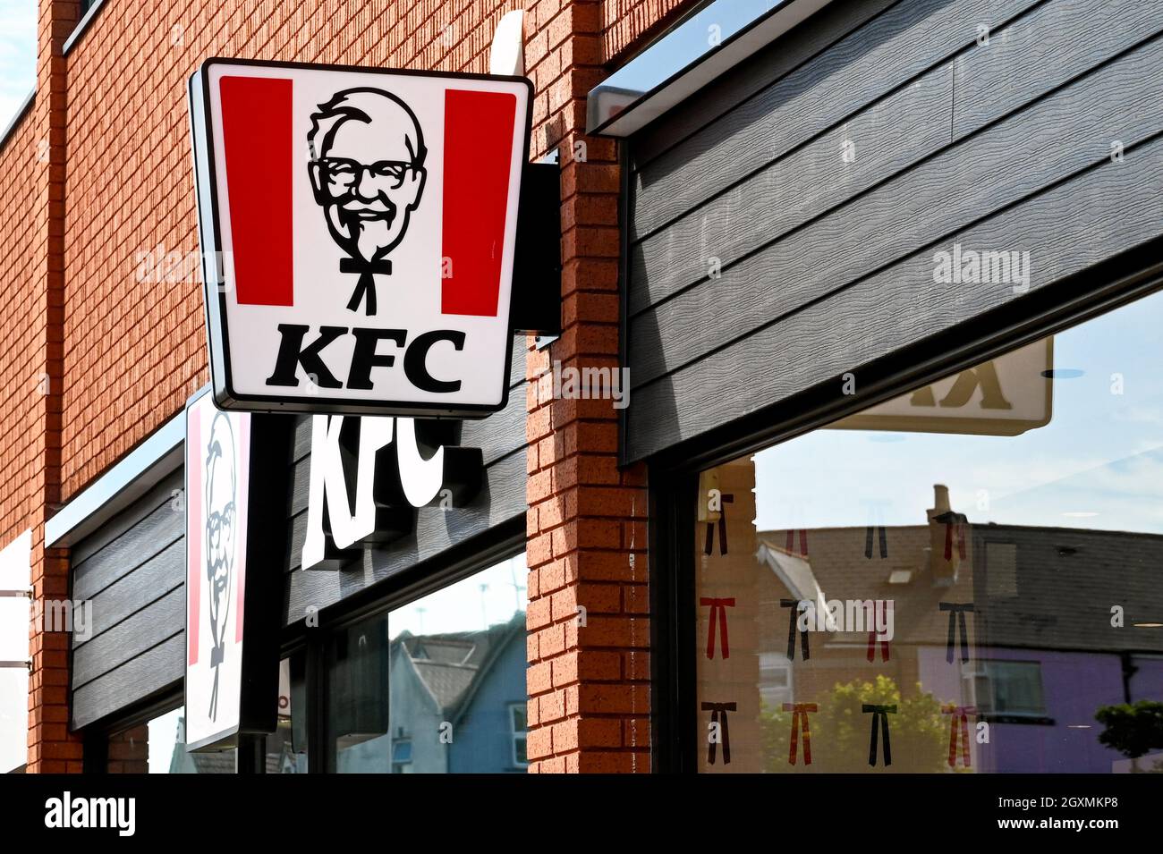Oxford, England - June 2021: Sign above the entrance to a  Kentucky Fried Chicken fast food outlet Stock Photo