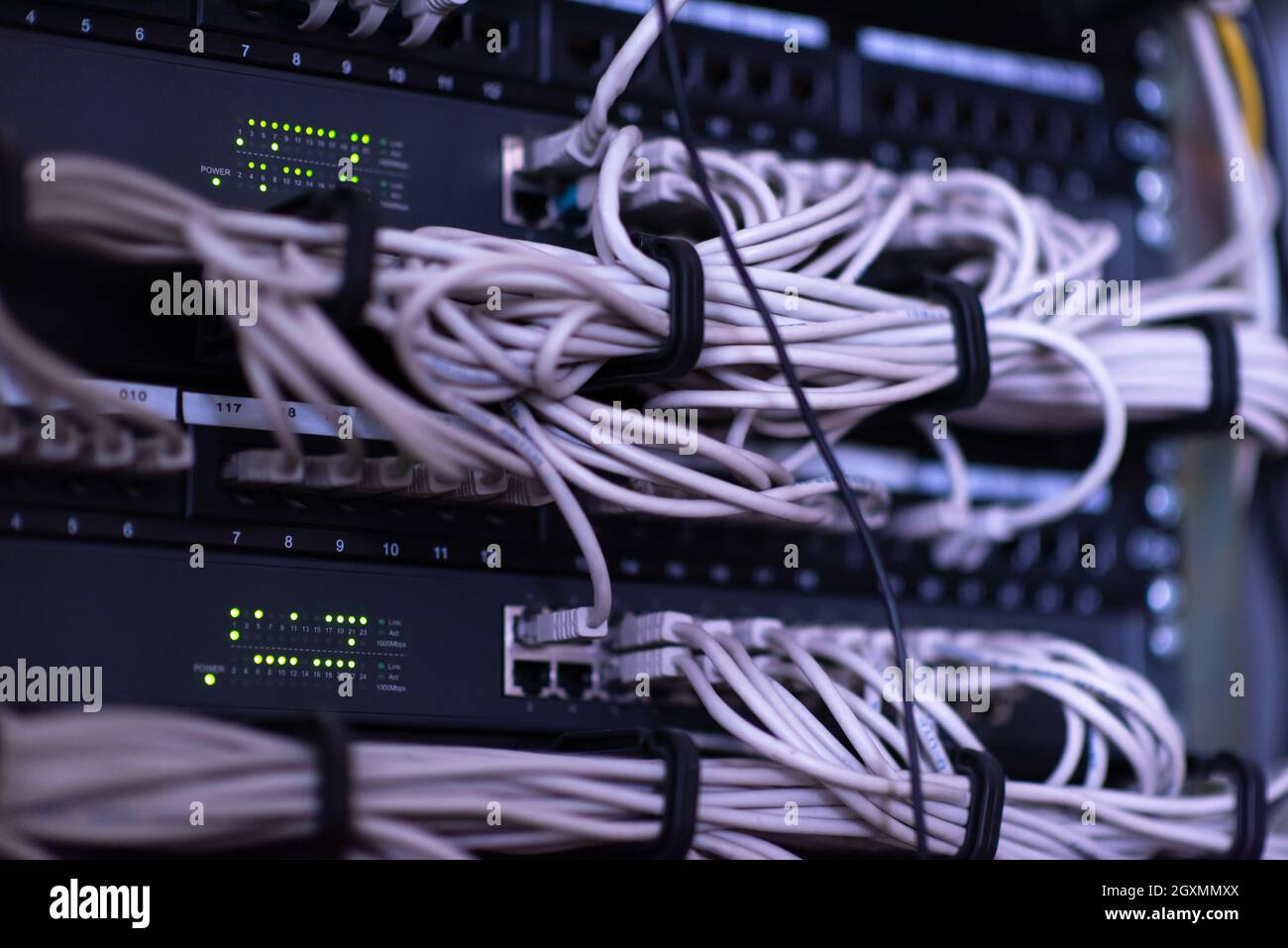 optical cables connected to the main server in the server room of the data center Stock Photo