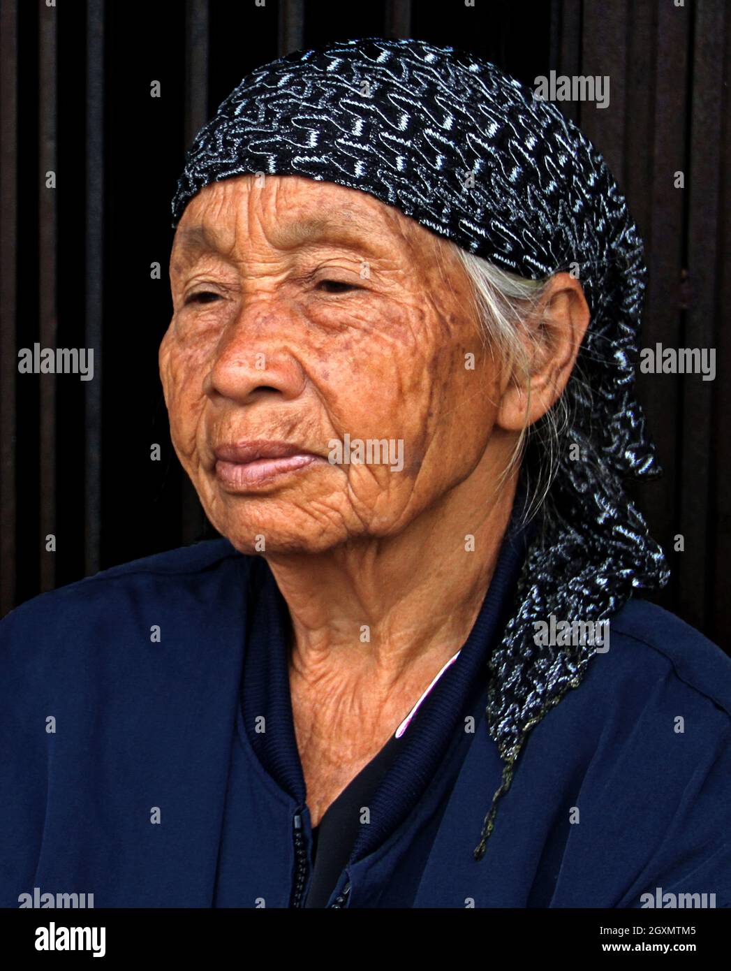 Old woman wearing blue headscarf hi-res stock photography and images - Alamy