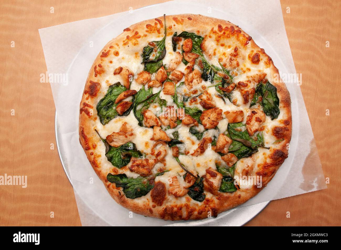 Delicious Italian cuisine known as chicken alfredo pizza Stock Photo