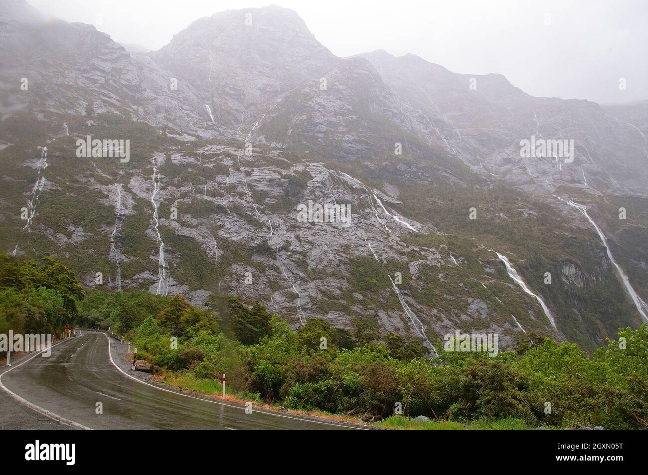 Glacial waterfalls at the exit of the Homer Tunnel, Fiordland National Park, South Island, New Zealand Stock Photo