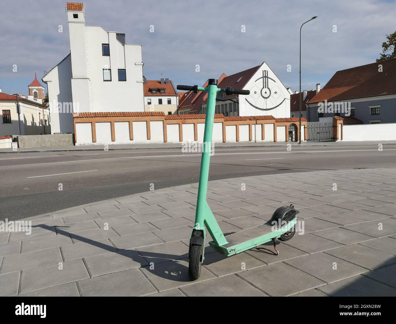 Environment friendly scooter for public rent parked at the street of Kaunas, Lithuania Stock Photo