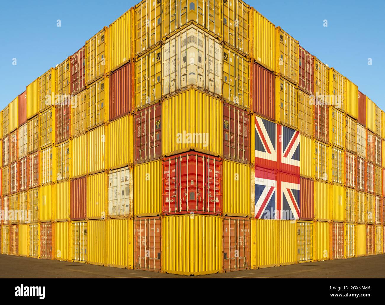 UK flag on shipping containers in docks. Post Brexit uk trade deals, container shortage, shipping costs, uk economy hgv driver shortage... concept. Stock Photo