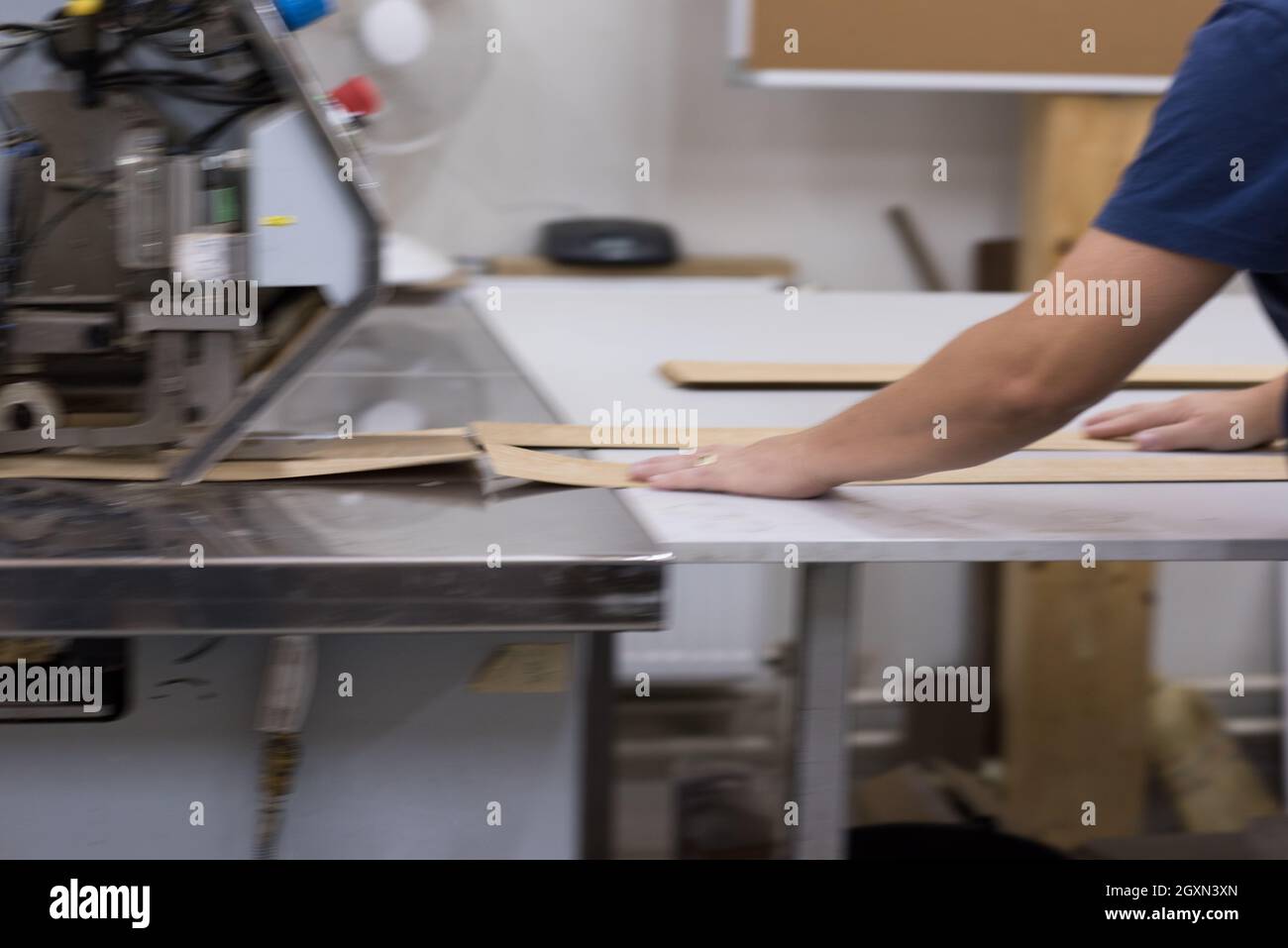 young positive engineer in front of furniture manufacture production at