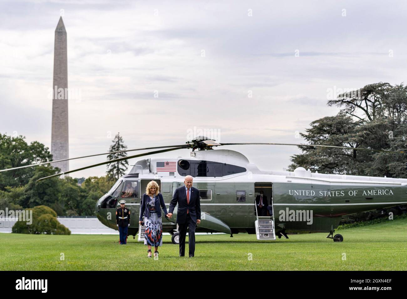 Washington, United States Of America. 04th Oct, 2021. Washington, United States of America. 04 October, 2021. U.S President Joe Biden and First Lady Dr. Jill Biden, hold hands as they walk across the South Lawn after arriving on Marine One at the White House October 4, 2021 in Washington, DC Credit: Adam Schultz/White House Photo/Alamy Live News Stock Photo