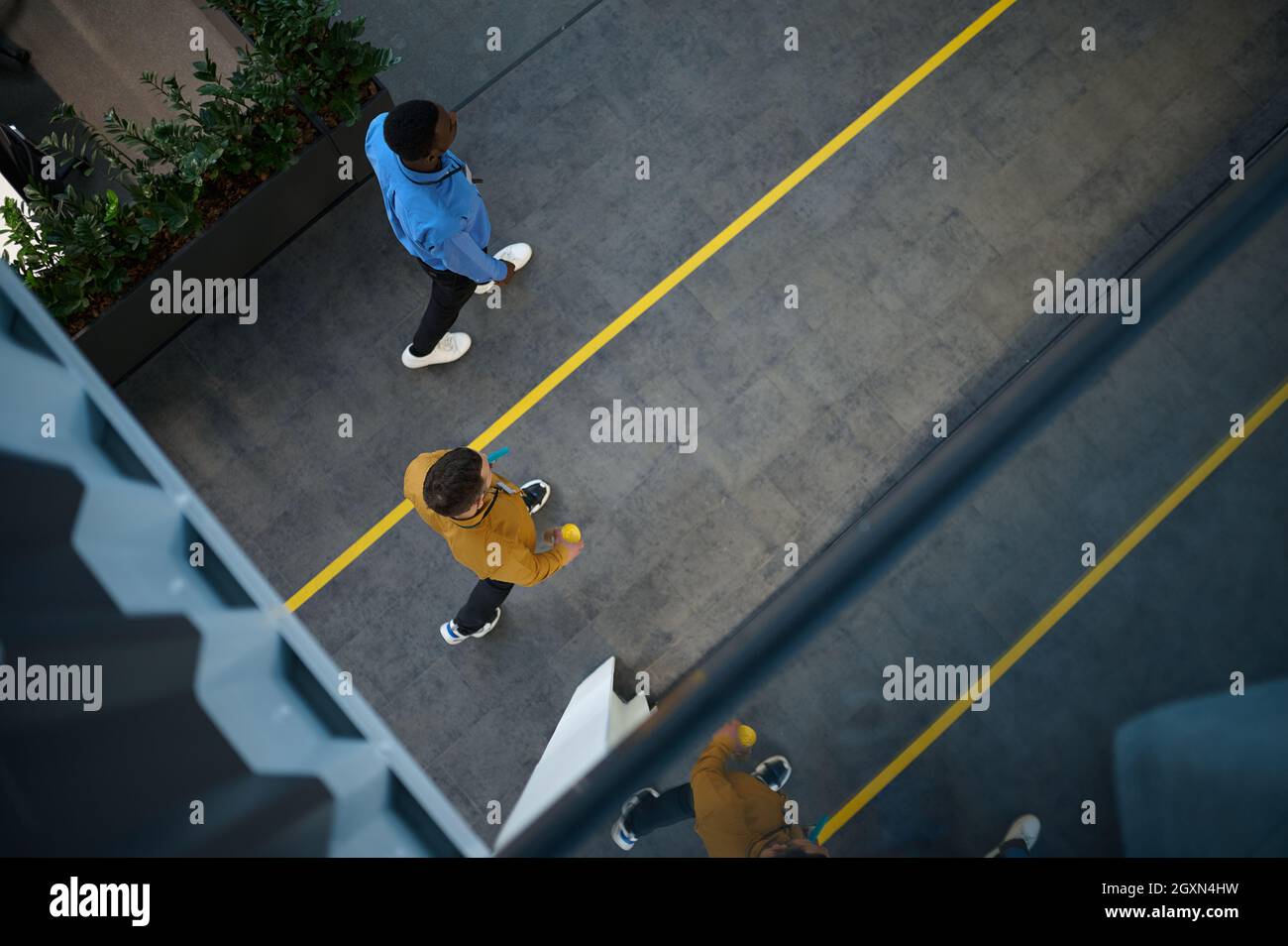 Two employees, top view from balcony in IT office Stock Photo