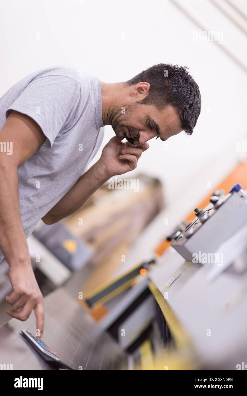 young positive engineer in front of furniture manufacture production at