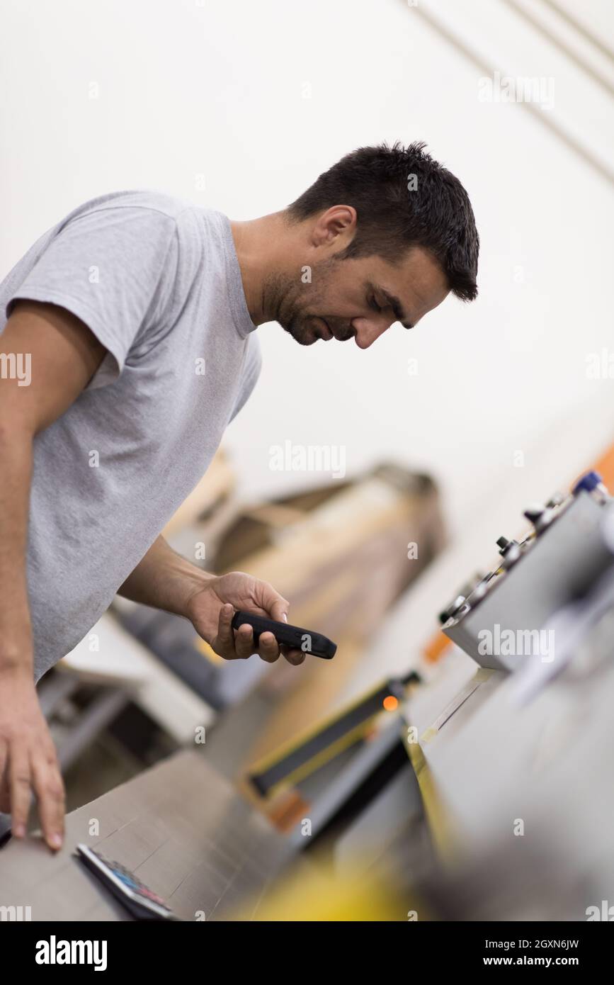 young positive engineer in front of furniture manufacture production at