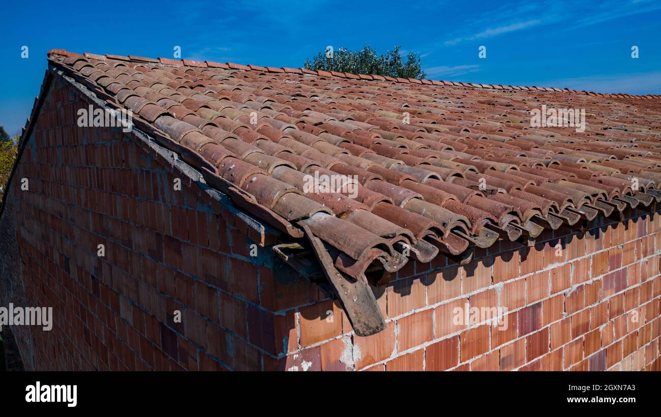 Roof Shingles damaged and in need of repair Stock Photo