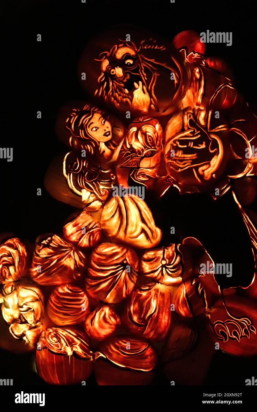 An illuminated light sculpture of the Beauty and the Beast characters