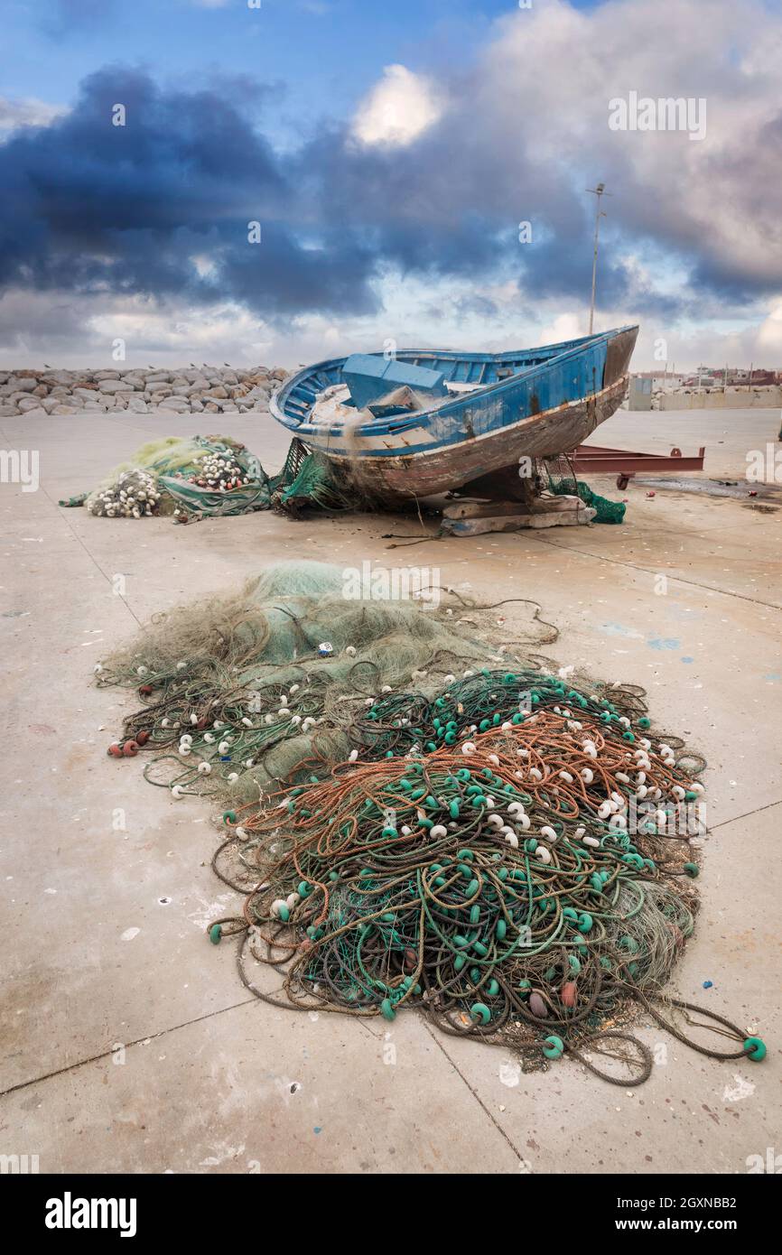 Boat and fishing nets on wharf, La Linea de la Concepcion, Spain Stock Photo