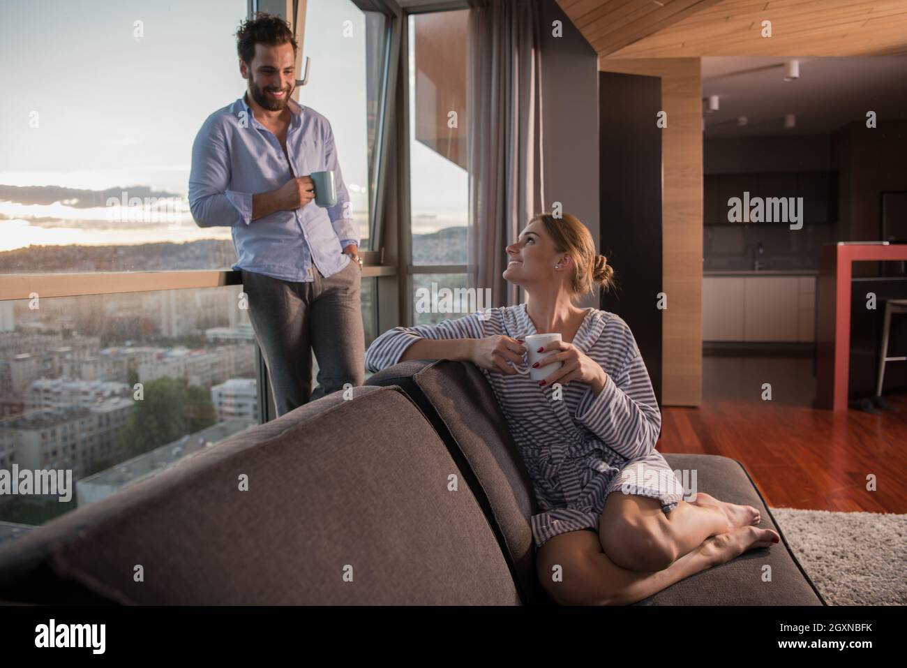 romantic happy young couple enjoying evening coffee and beautiful ...