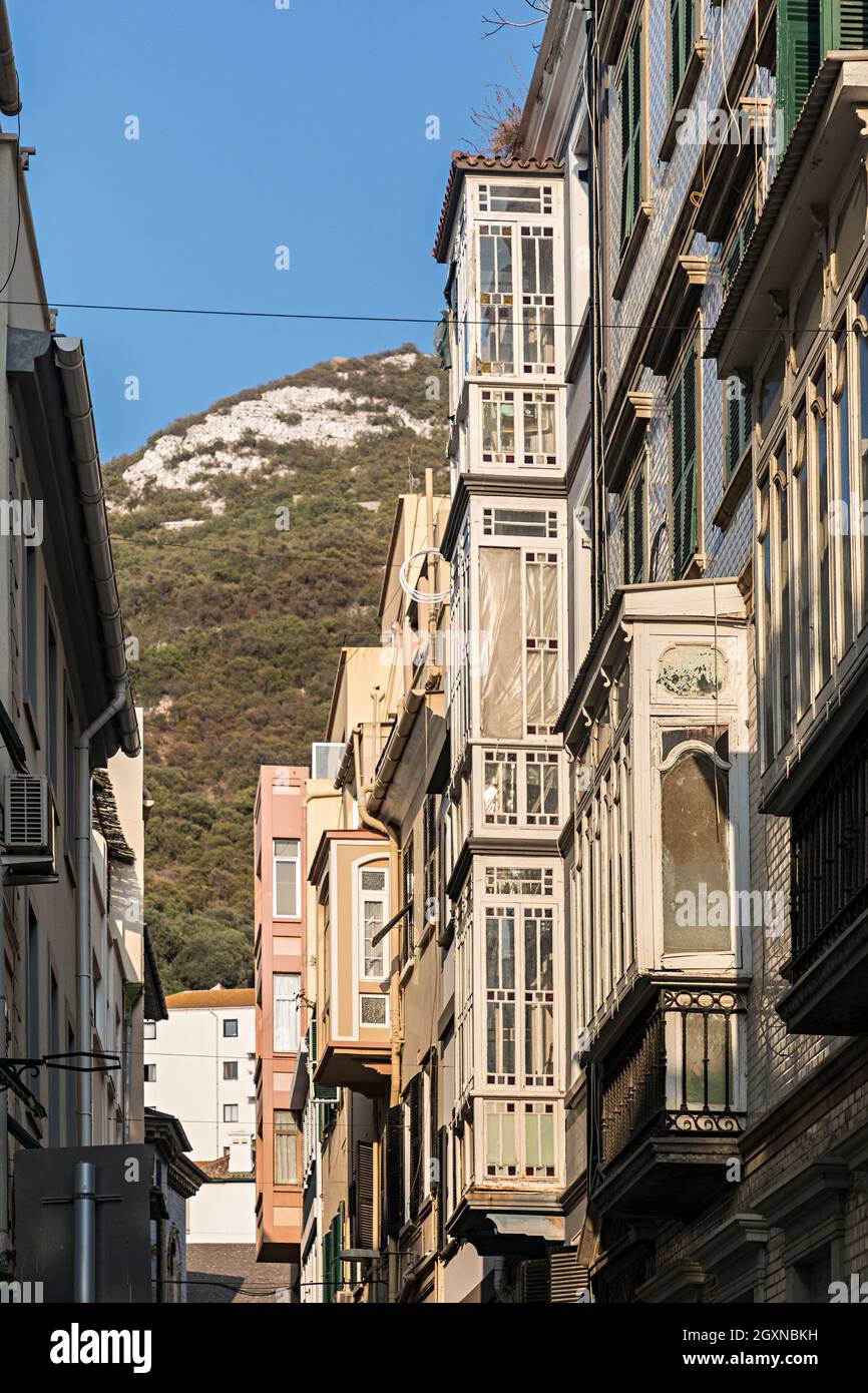 Covered balconies in side street, Gibraltar Stock Photo