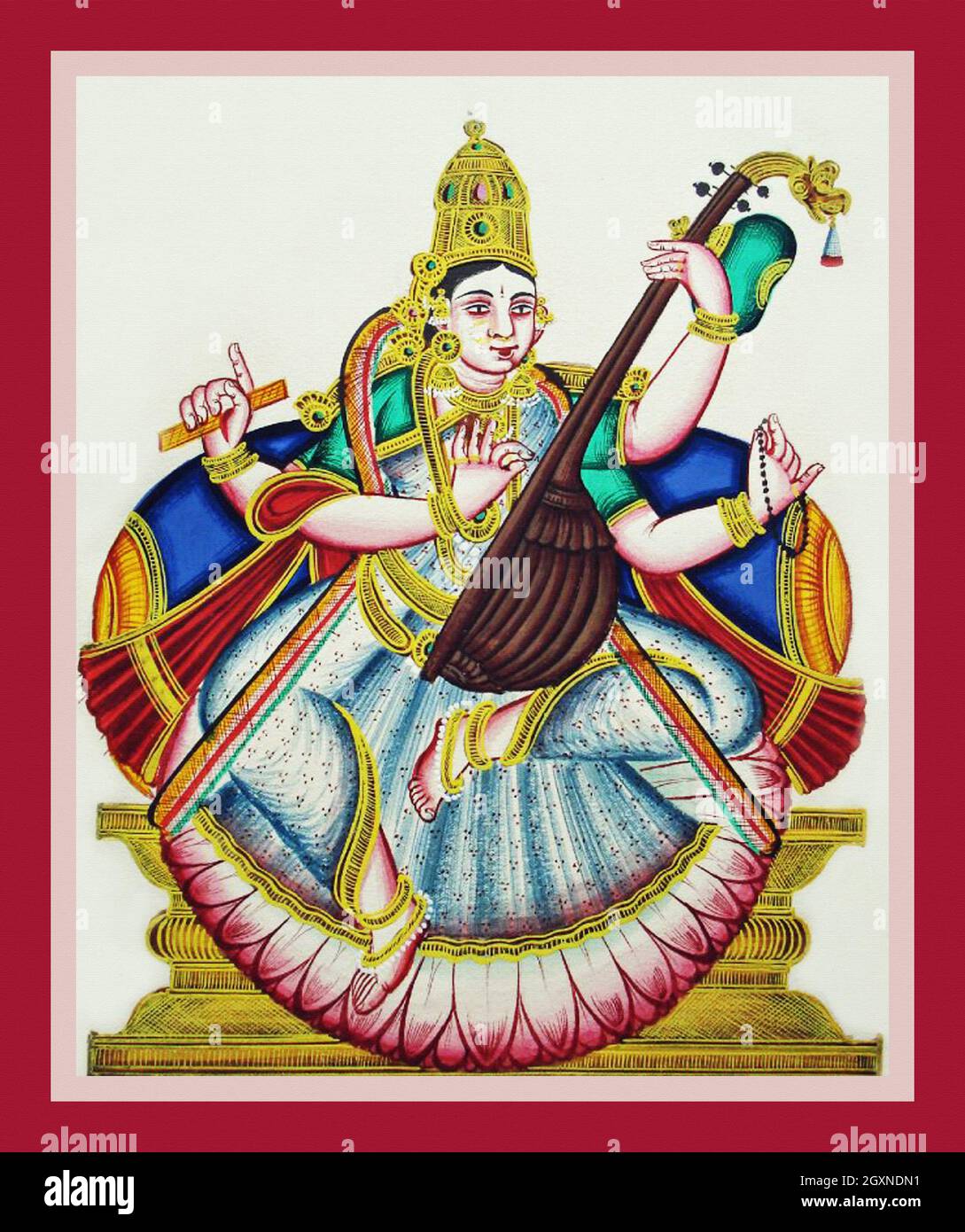 Sarasvatī sits in lalitasana on a lotus flower Stock Photo