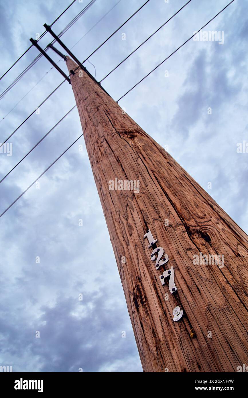 Telephone pole communications with dark clouds Stock Photo