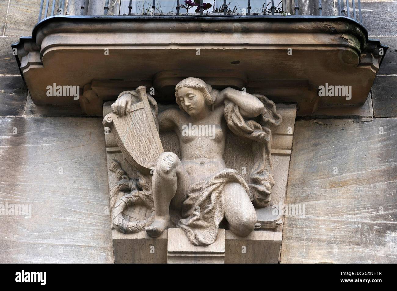 Woman with laurel wreath hires stock