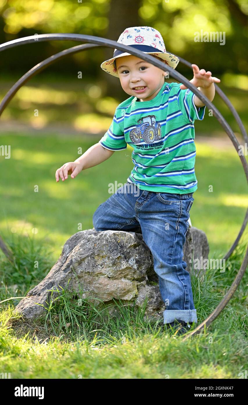 Toddler, 2 years, multi-ethnic, Eurasian, plays in the park, Baden-Wuerttemberg, Germany Stock Photo