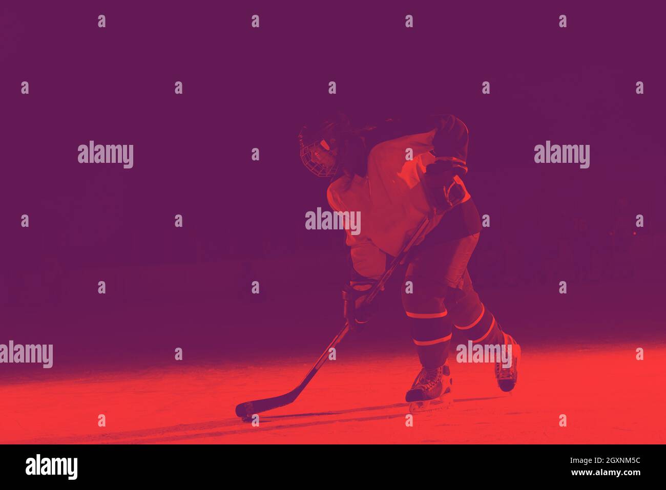 teen girl children ice hockey player in action kicking puck with stick