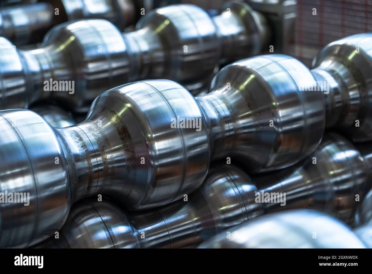 Steel rollers close up. Metalforming machine for production roof tile. Stock Photo