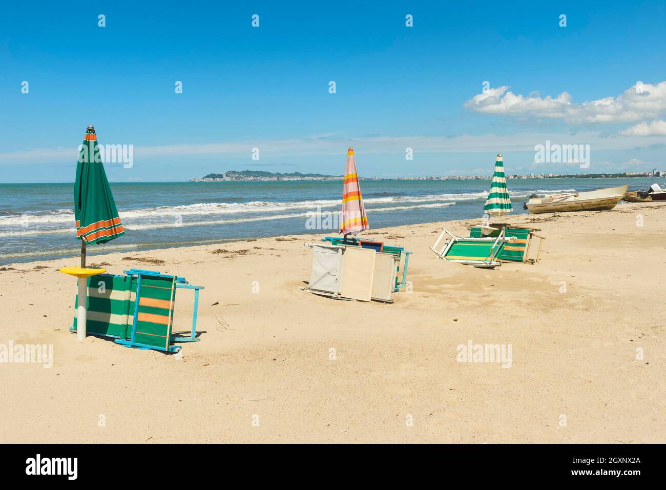 Beach umbrellas and deckchairs at the beach, Durres, Albania Stock