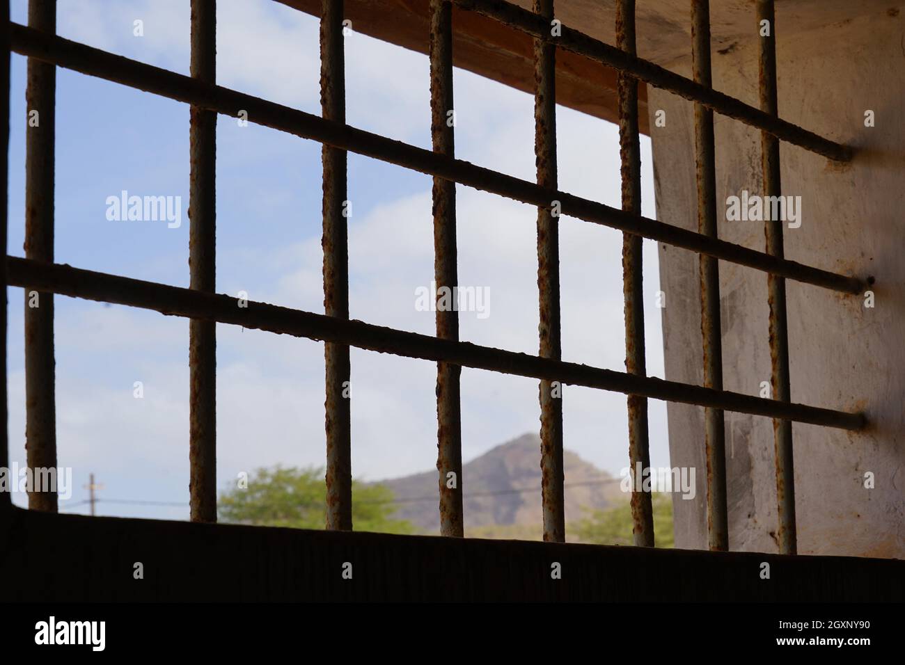 Barred window of a communal cell, bathroom, Tarrafal concentration camp, Santiago Island, Republic of Cape Verde Stock Photo