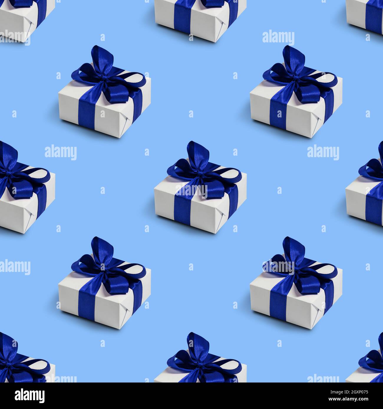 Seamless pattern with gifts on blue background. Christmas decorations. Stock Photo