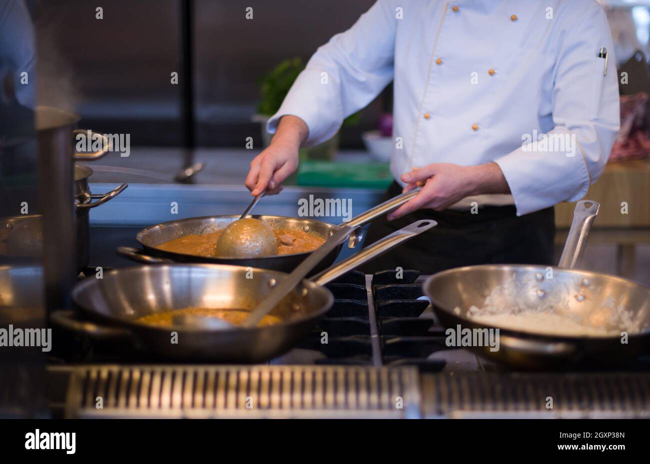 Master chef preparing food, frying in wok pan. Sale and food concept Stock  Photo - Alamy