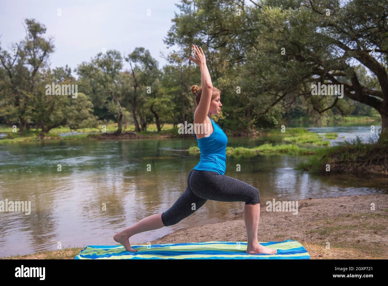 Healthy Woman Doing Yoga Exercise In The Beautiful Nature On The