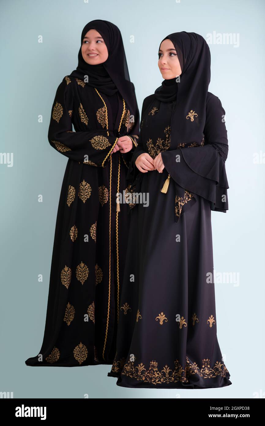 beautiful muslim woman in fashinable dress with hijab isolated on cyan  background representing concept of modern islam fashion with mix of  traditio Stock Photo - Alamy