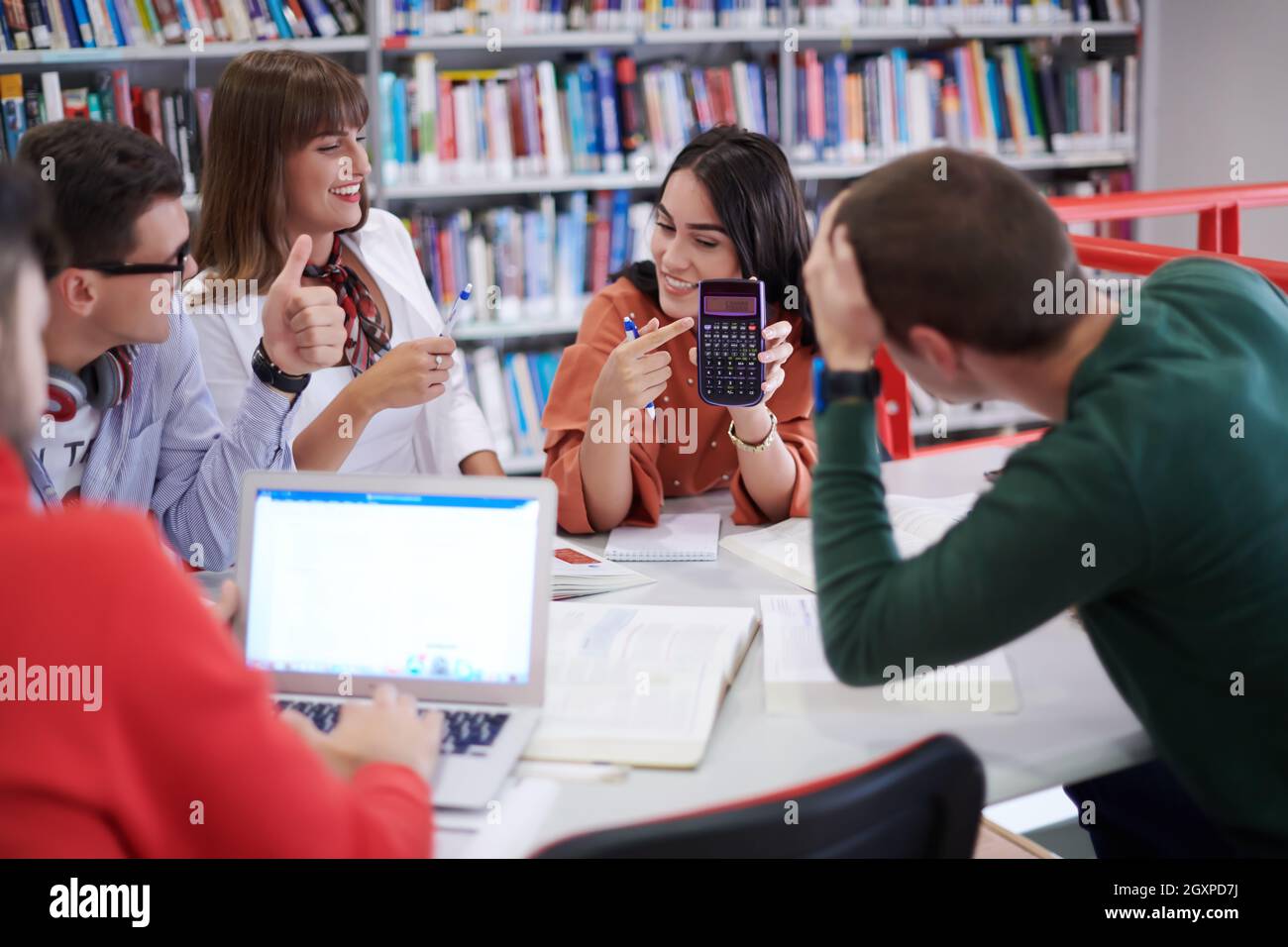 Elibrary Project For Students a group of students sit in a library and create a project for a school ...