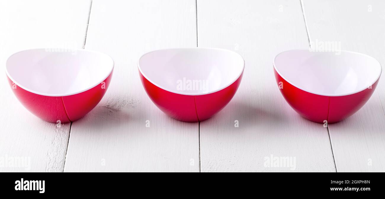 https://c8.alamy.com/comp/2GXPH8N/an-three-empty-red-cups-on-a-white-wooden-table-2GXPH8N.jpg