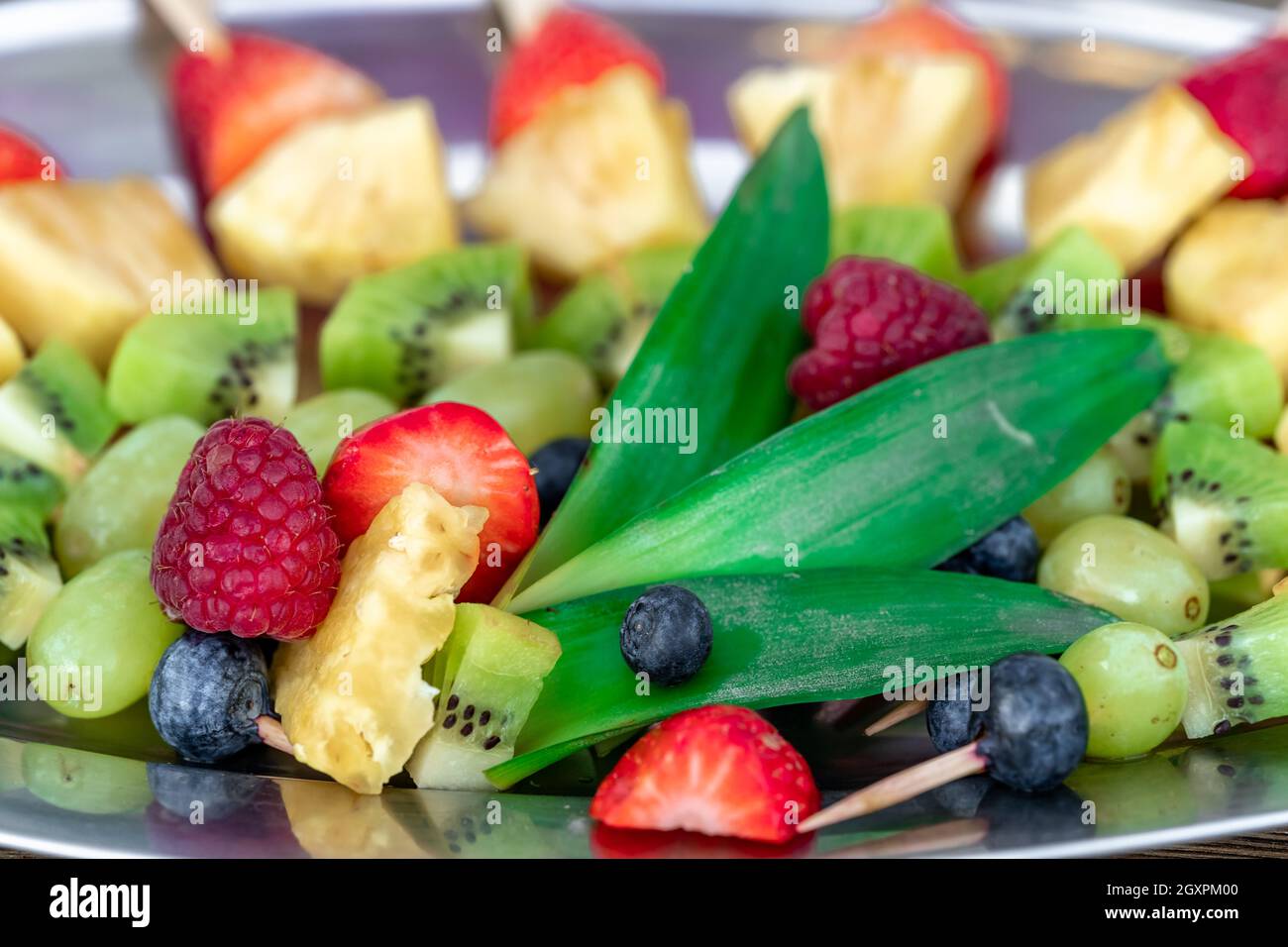 fruit skewers on a tray in celebration Stock Photo Alamy