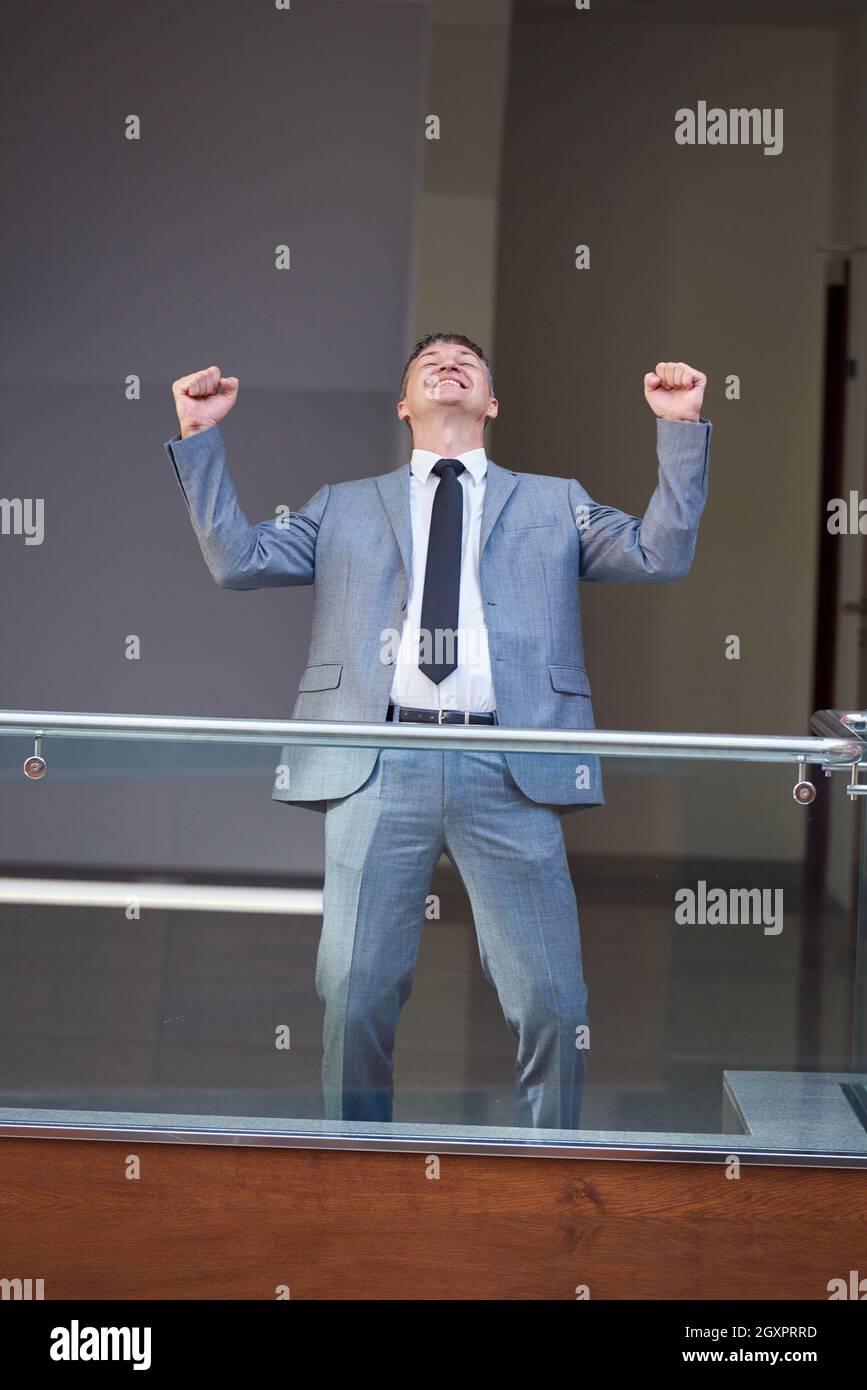 Excited business man raise hands hi-res stock photography and images ...