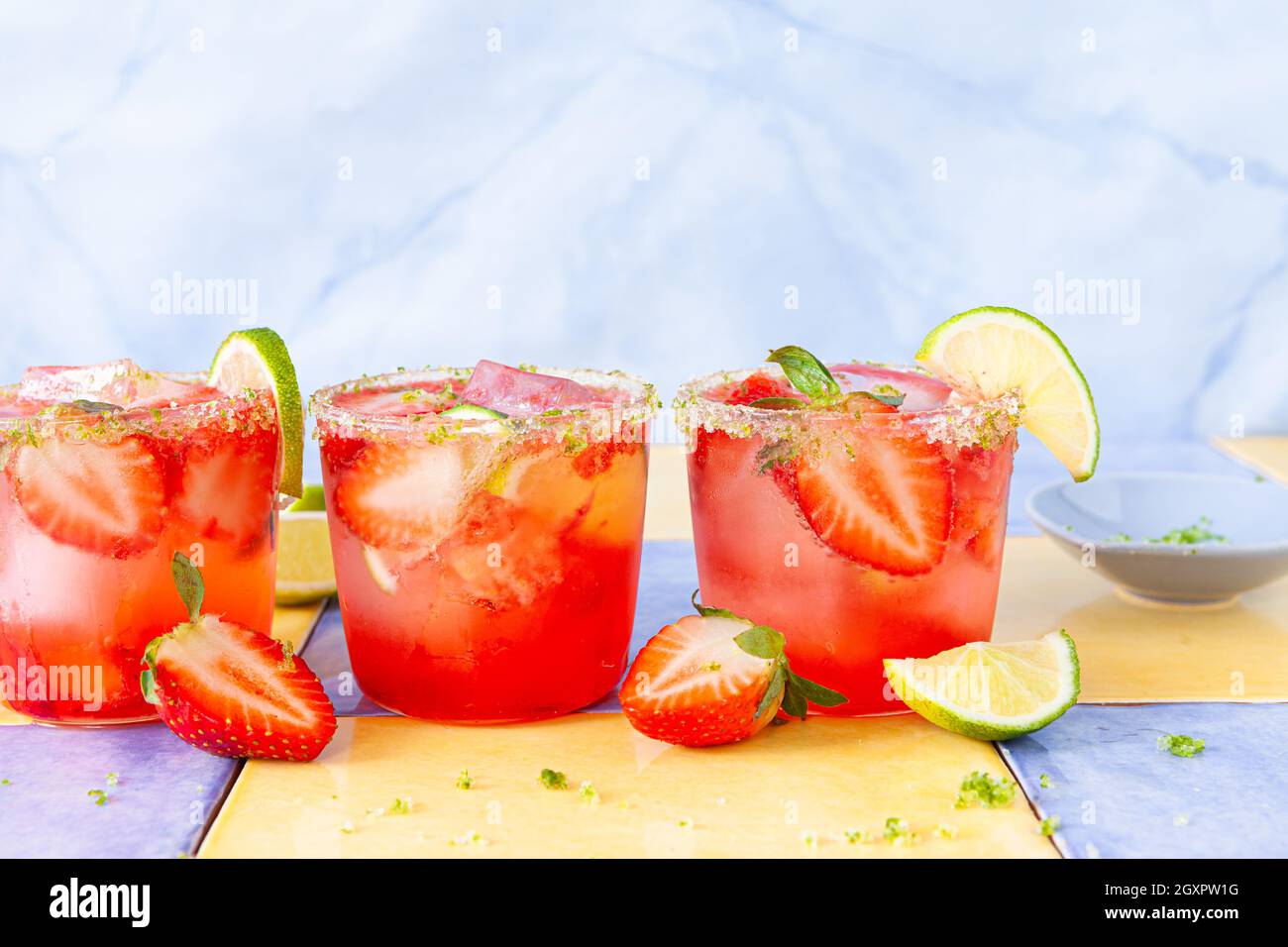 Ice cold cocktail with fresh strawberries and lime Stock Photo