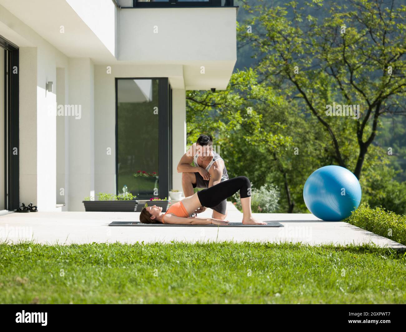Young Handsome Woman With Personal Trainer Doing Morning Yoga Exercises Photo Inspiration