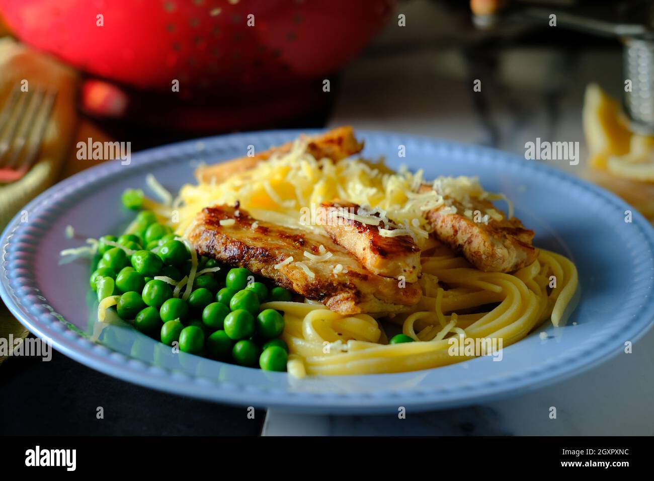 Italian chicken fettuccine alfredo with green peas Stock Photo Alamy