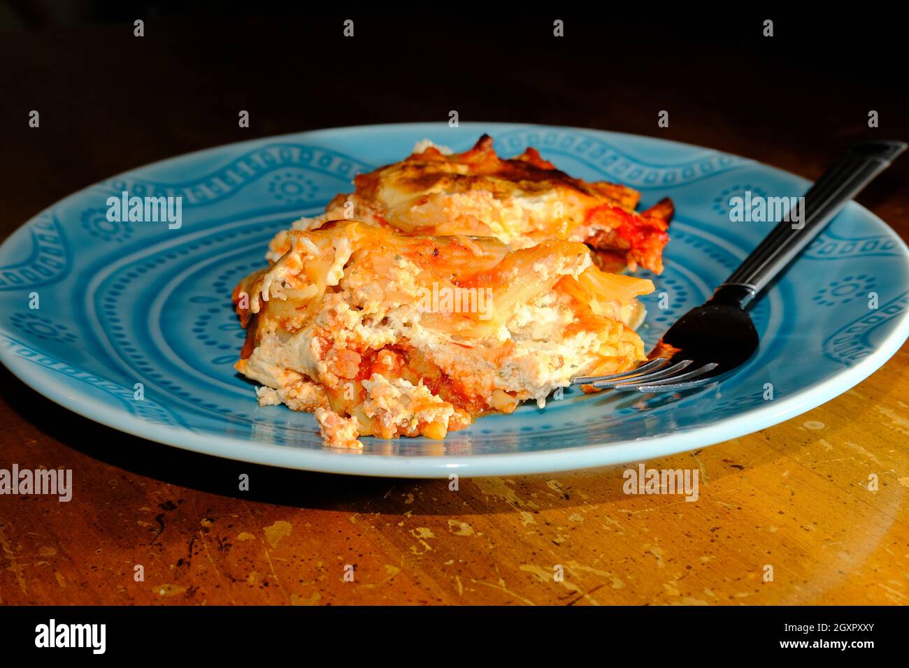 Baked ziti penne pasta dinner topped with fresh mozzarella and italian