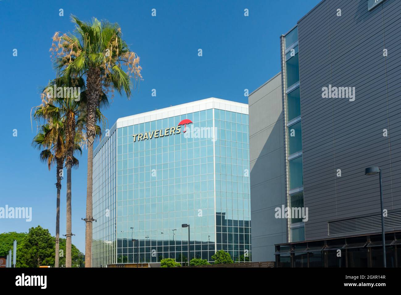 Irvine, CA, USA – August 16, 2021: Exterior building for Travelers Insurance with red umbrella in the Park Place area in Irvine, California. Stock Photo