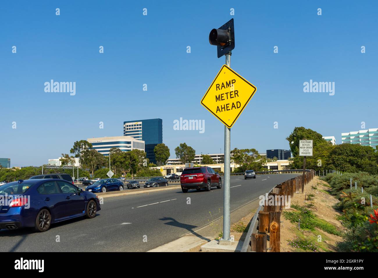 Irvine, CA, USA – August 16, 2021: Ramp Meter Ahead sign posted on the entrance to the 405 freeway in the Orange County city of Irvine, California. Stock Photo