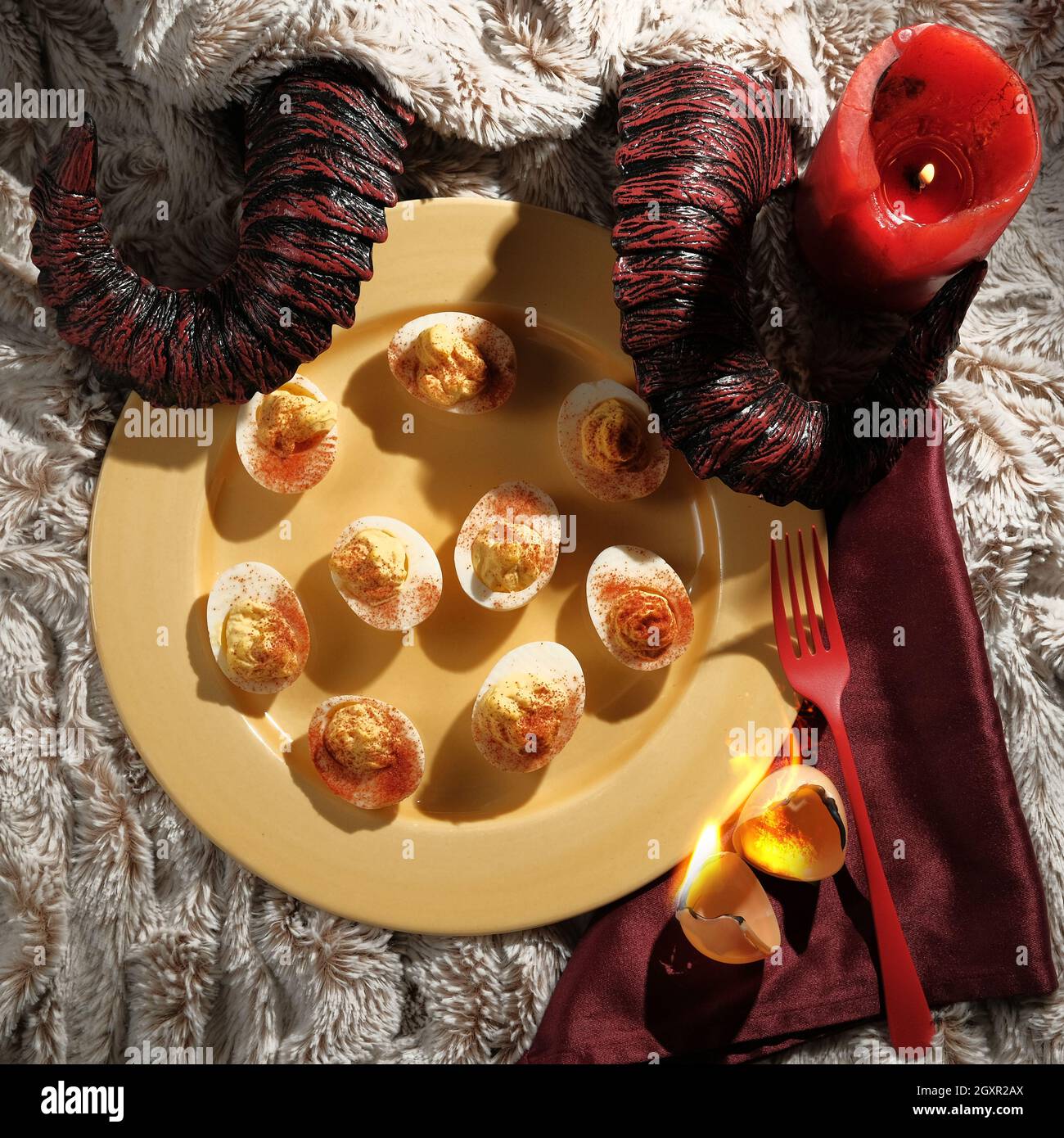 Satans recipe hellish deviled eggs with horns Stock Photo Alamy