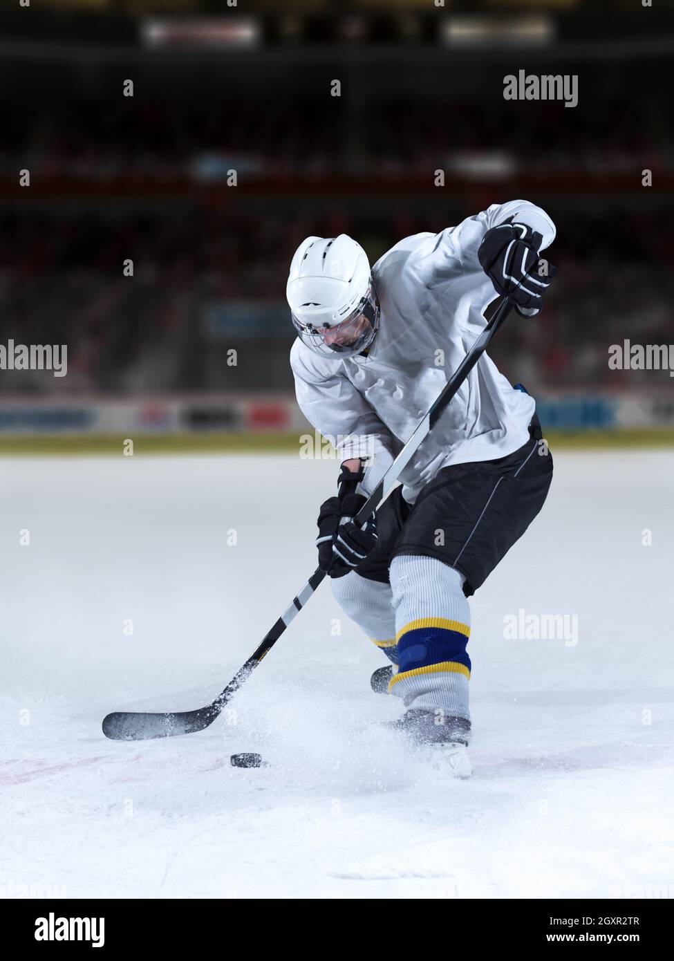ice hockey player in action kicking with stick Stock Photo Alamy