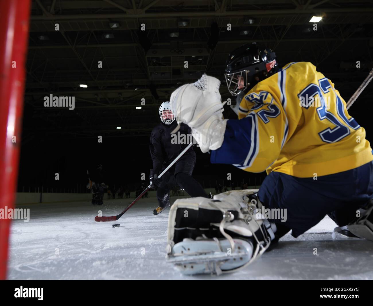 ice hockey goalkeeper player on goal in action Stock Photo Alamy