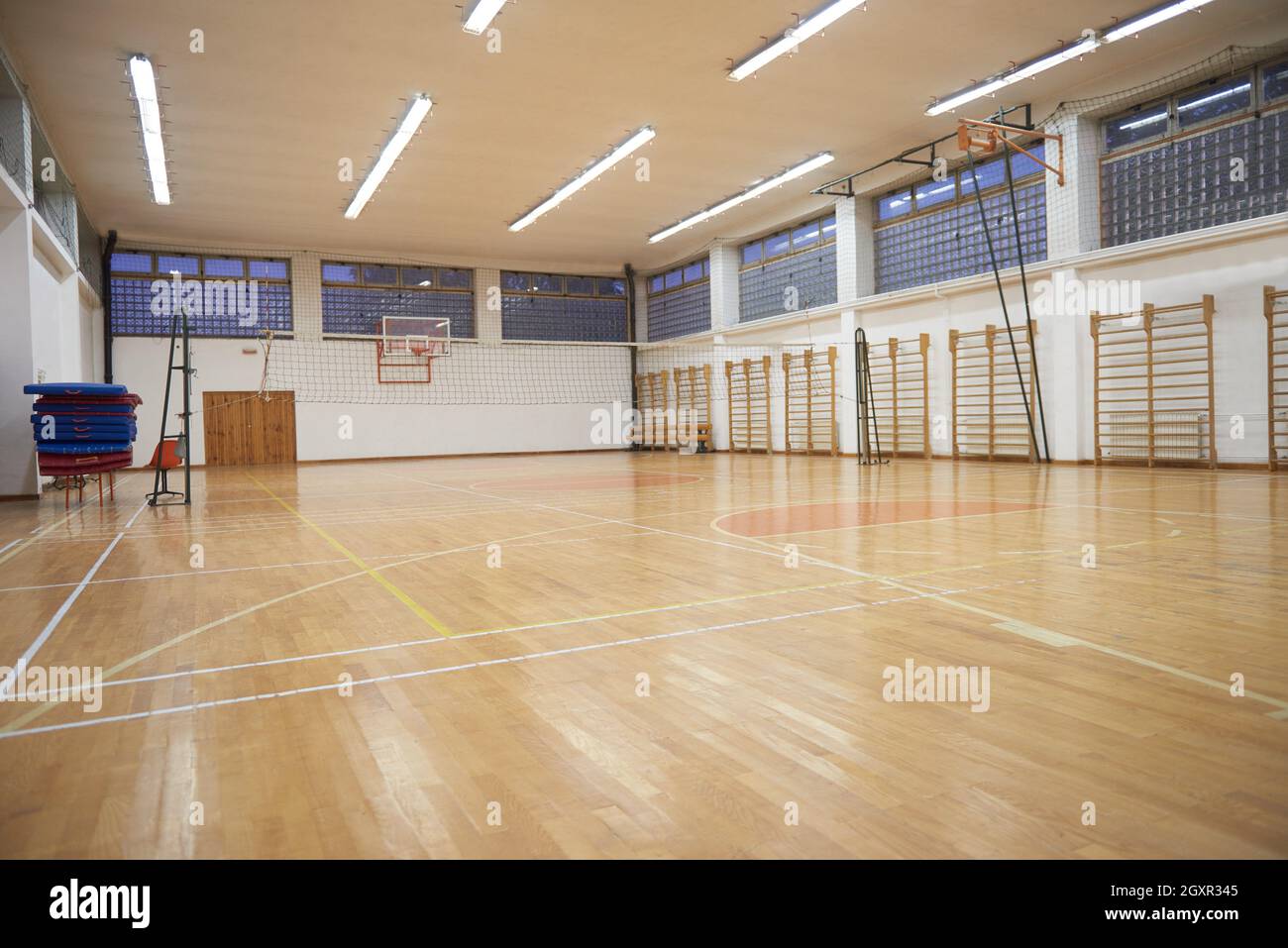 elementary school gym indoor with volleyball net Stock Photo