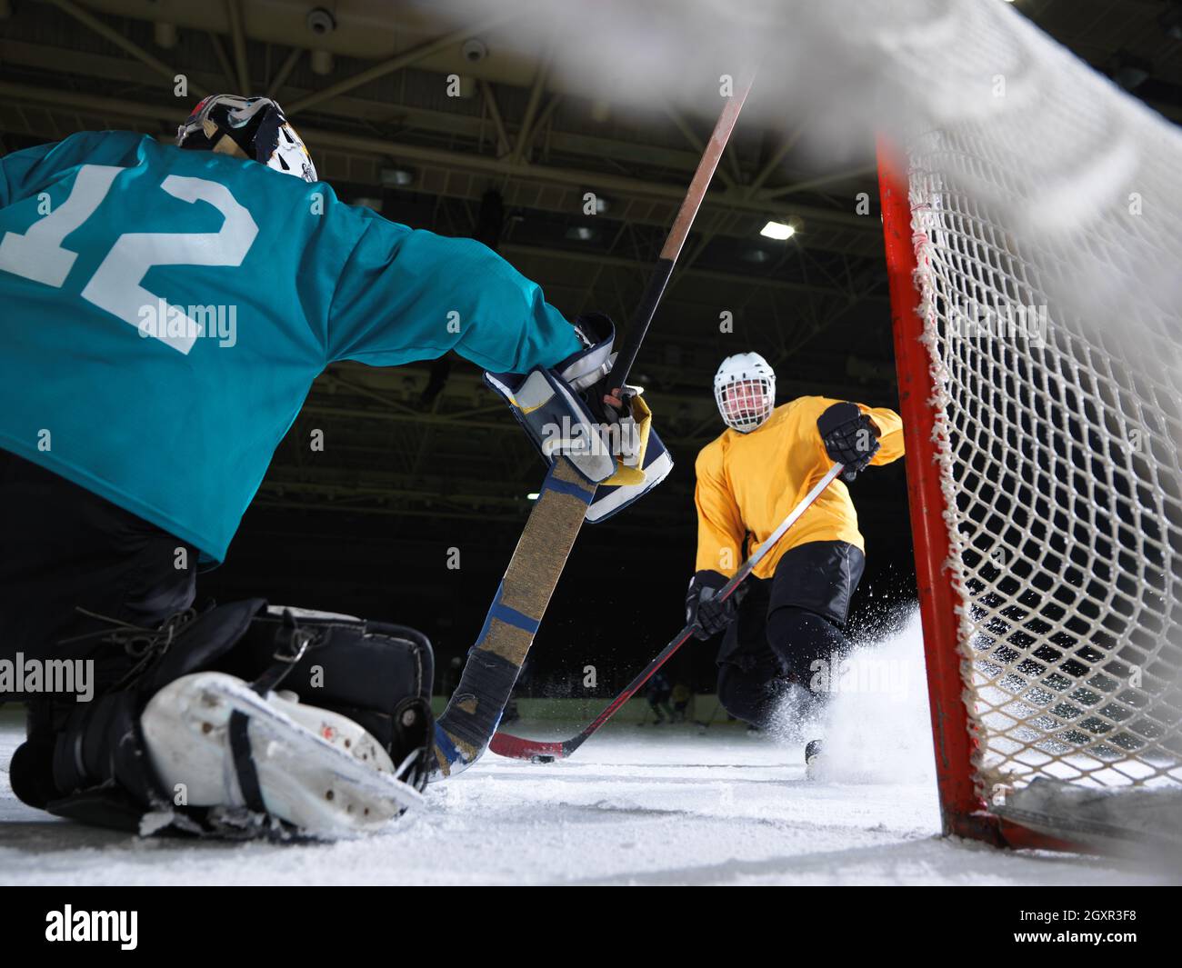 ice hockey goalkeeper player on goal in action Stock Photo Alamy