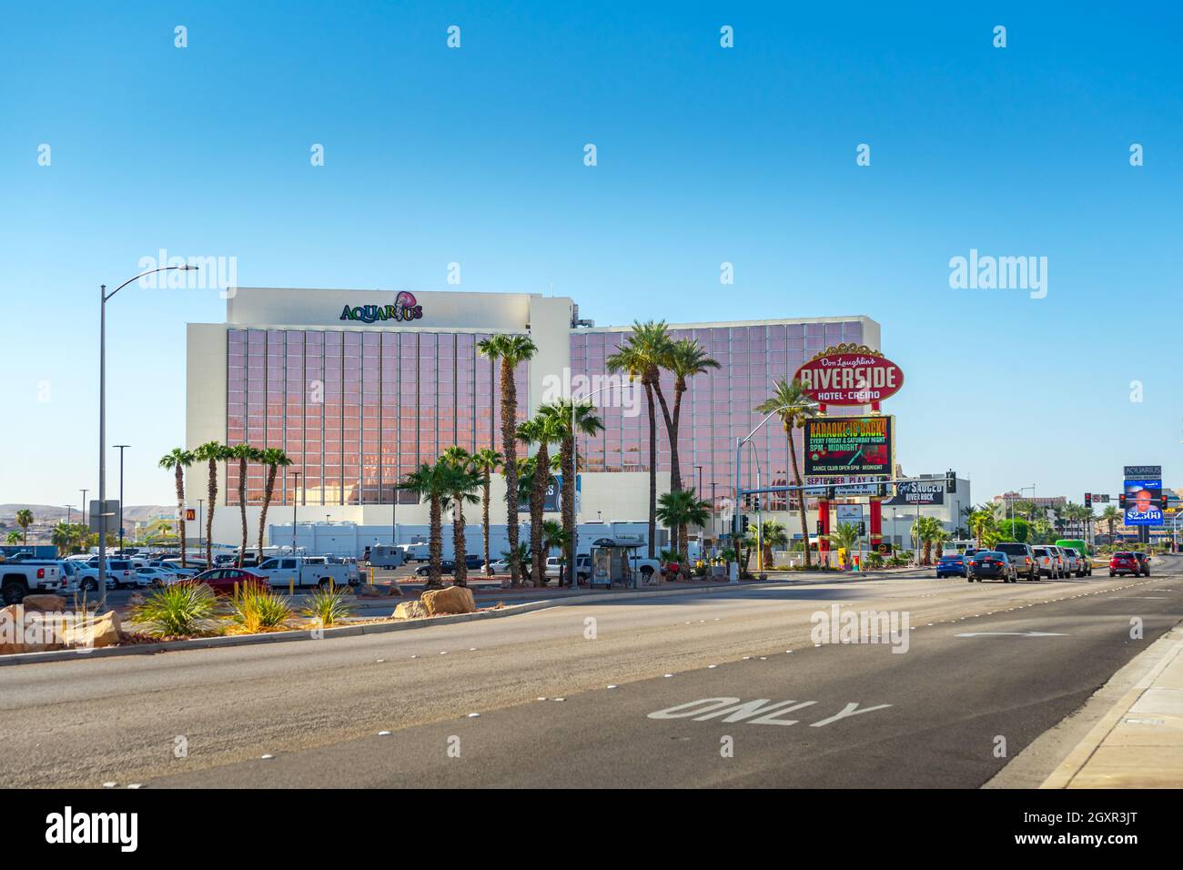 Laughlin, NV, USA – August 27, 2021: Street view of Aquarius Resort building and the Riverside Hotel and Casino sign on Casino Drive in Laughlin, Neva Stock Photo