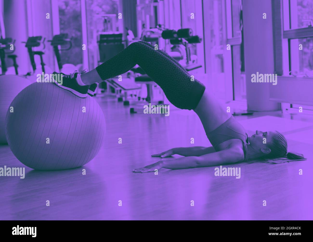 woman exercise pilates in fitness gym club duo tone Stock Photo Alamy