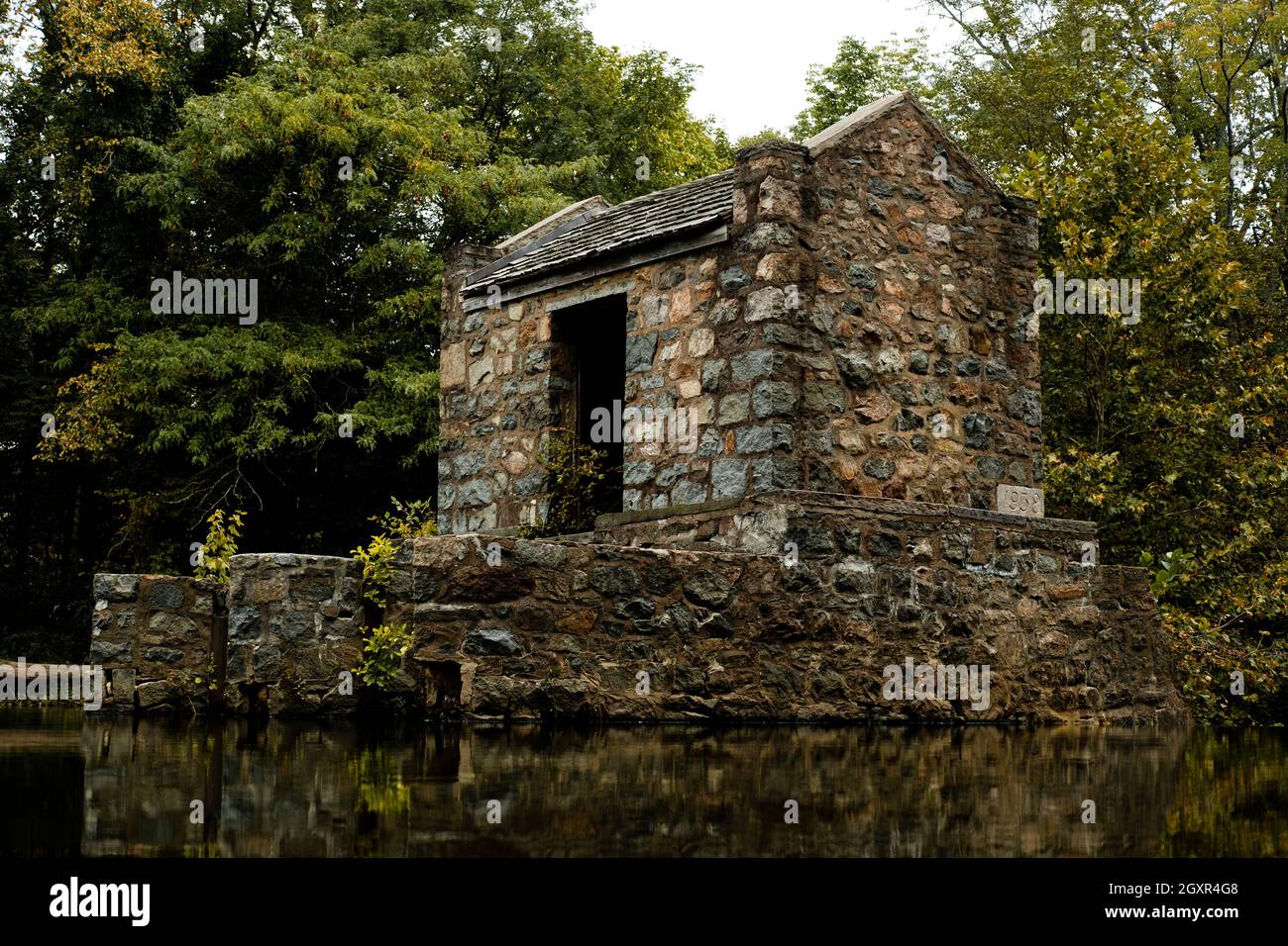 Tranquil speedwell lake park historic Ironworks building in Morristown, NJ Stock Photo