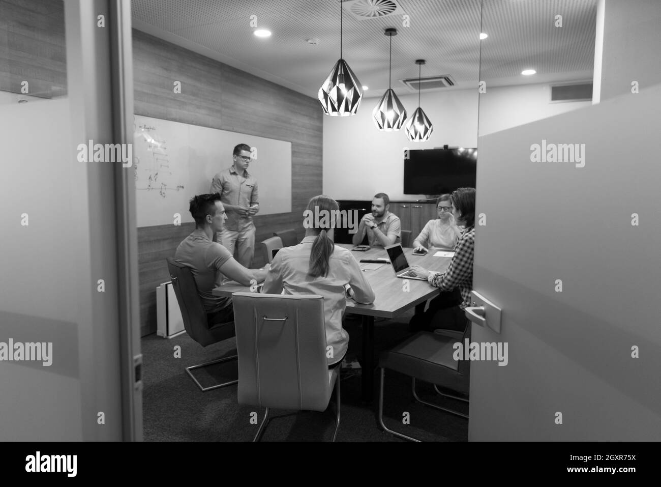 startup business people team brainstorming on meeting   working on laptop and tablet computer Stock Photo