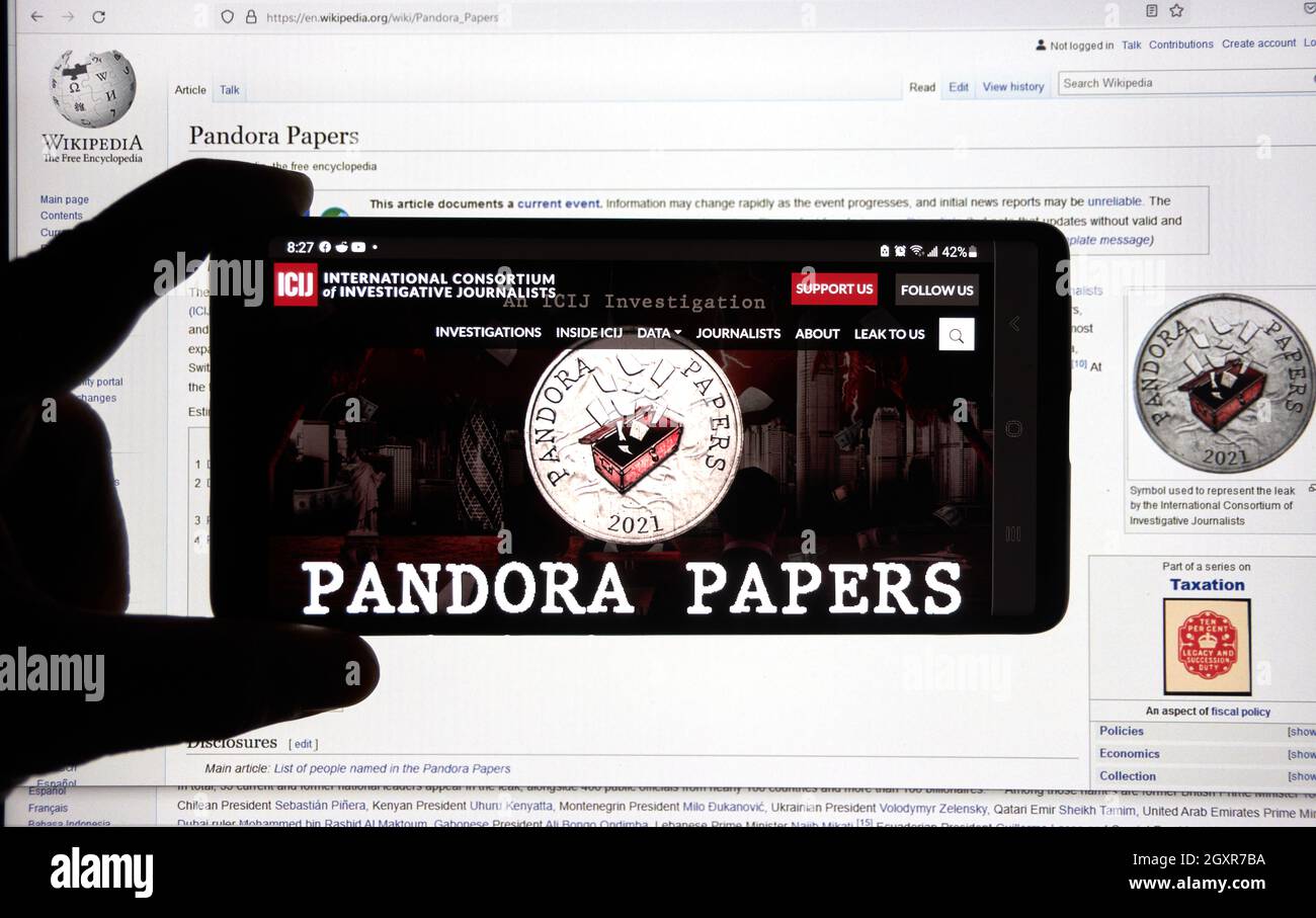 Montreal, Canada - October 5, 2021: The Pandora Papers website on cellphone. It's a leaked set of 12 million documents and files exposing the secret w Stock Photo