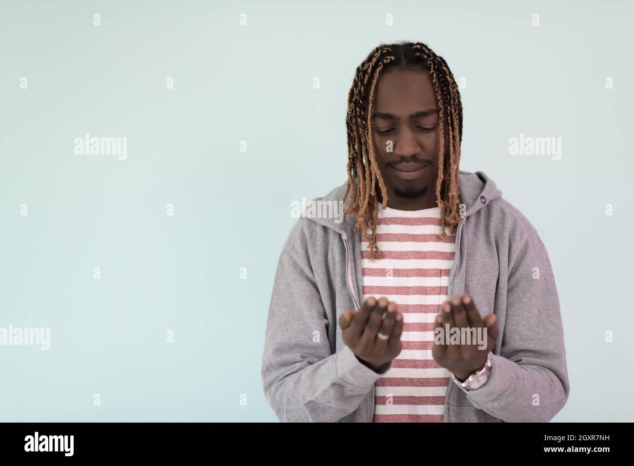 Handsome Young African Muslim Man Making Traditional Fatiha Prayer To Allah God Stock Photo